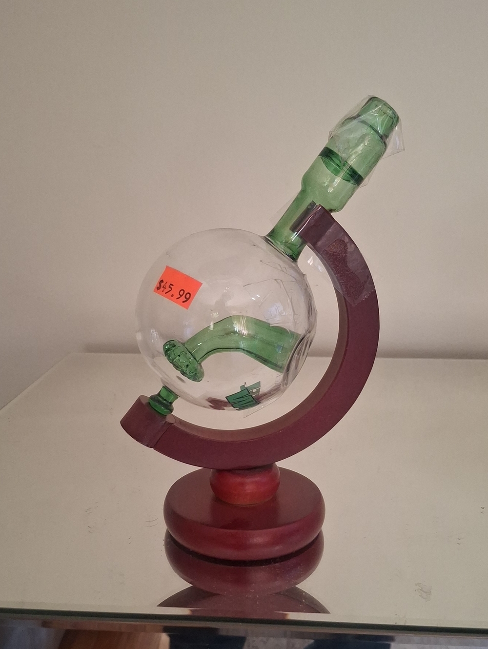 Decorative Green Glass Globe Bottle on Wooden Stand